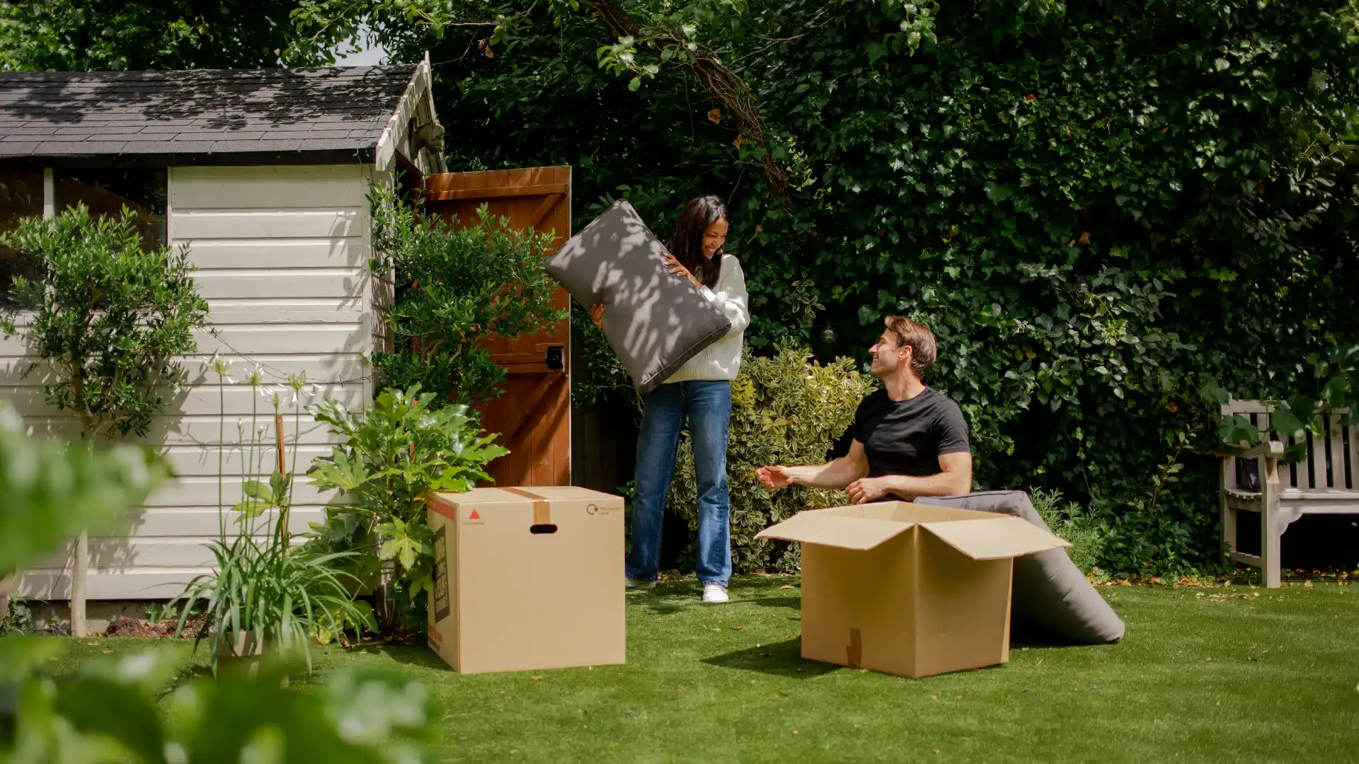 couple packing garden shed