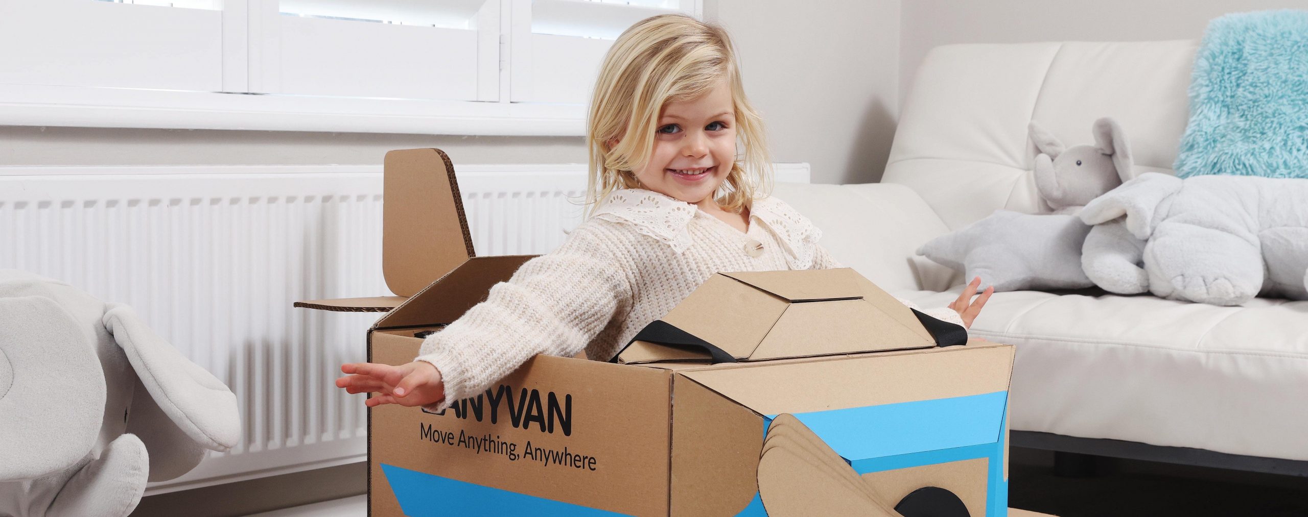 child in an anyvan box toys - box plane